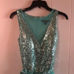 Sequined romper with mesh skirt.